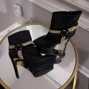 J Lo black and gold ankle boots
